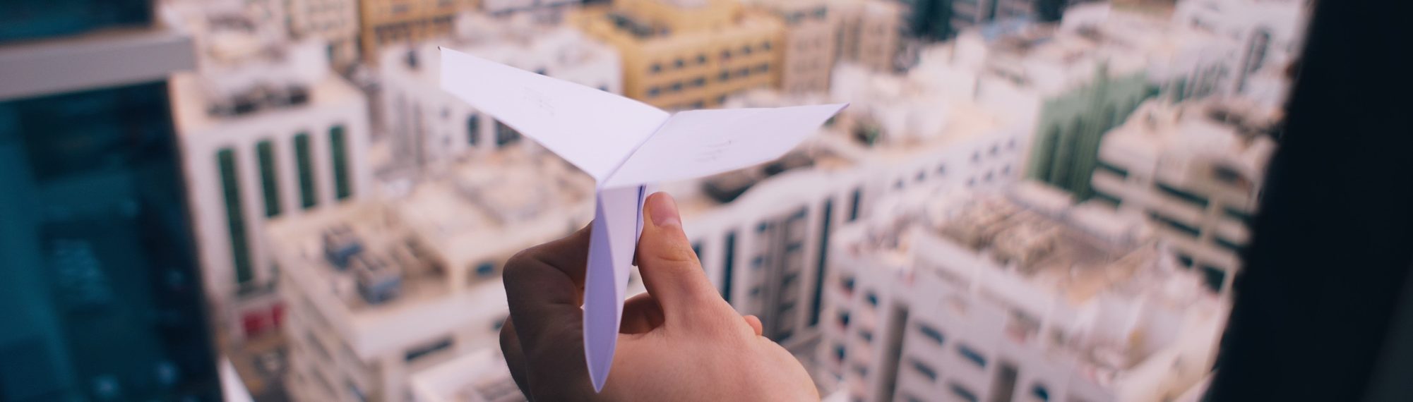 Person throwing a paper airplane